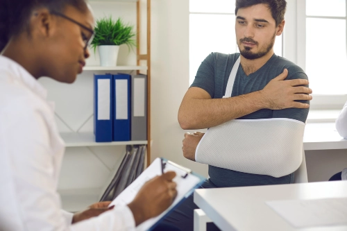 Injury doctor speaks with her client