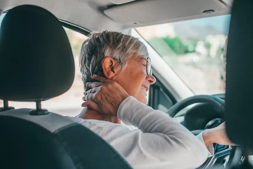 Atlanta car accident victim experiencing whiplash neck pain after collision