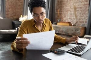Woman Looking at Medical Bills