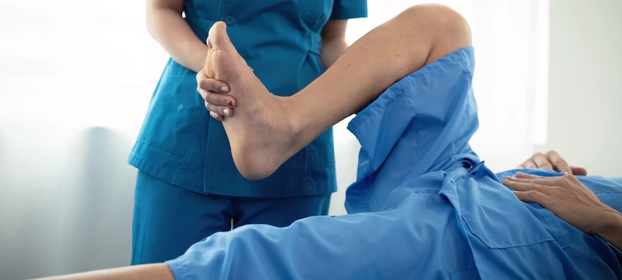 A personal injury doctor is performing physical therapy on a client in Marietta.