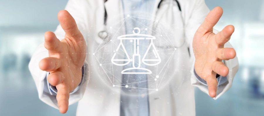 A doctor is referring someone to a Marietta personal injury lawyer.
