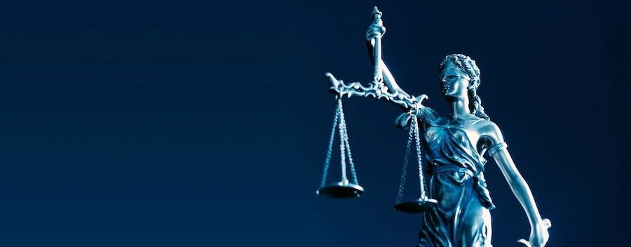 A small lady of justice statue represents a Marietta personal injury lawyer.