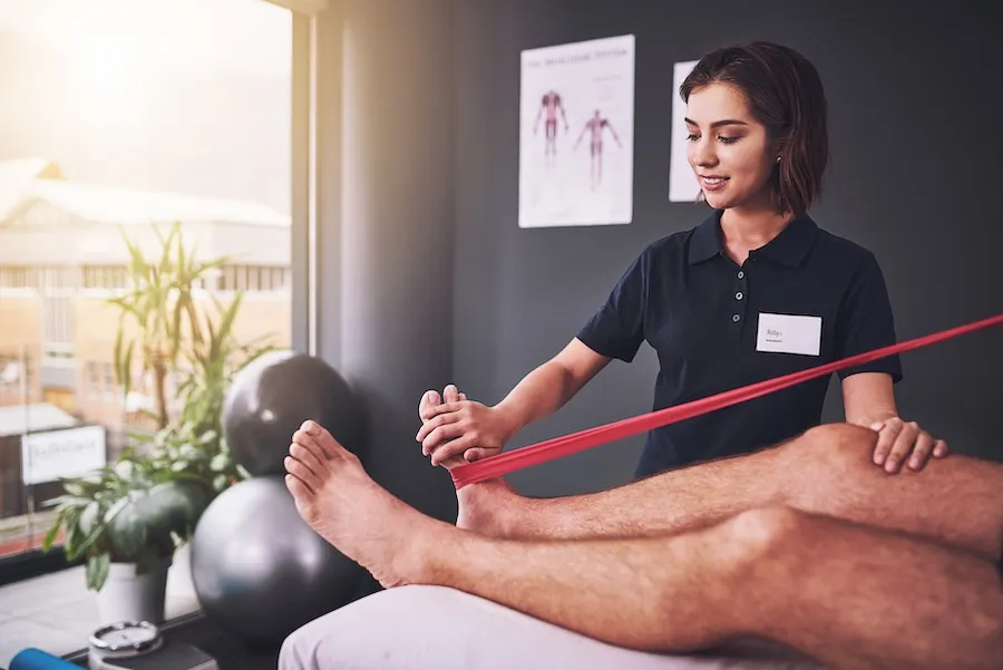 A physical therapist is performing a functional capacity evaluation on a patient.